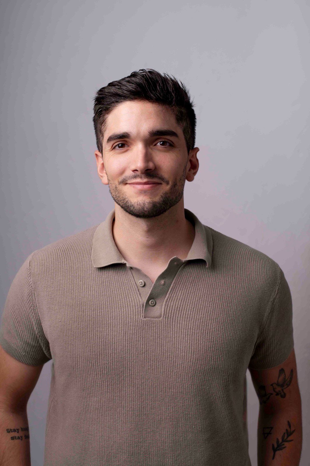 Nicolas Santos, founder of AetherWorks, photographed against a plain grey background.